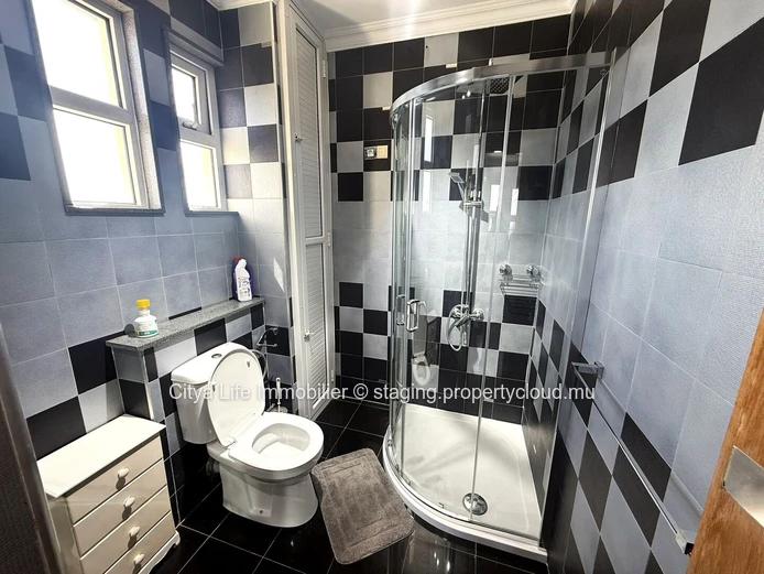 Luxurious 4-Bed penthouse in Quatre Bornes with Rooftop Access & Mountain Views.