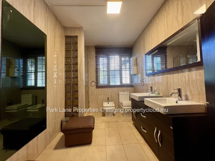 Double-storey home overlooking a magnificent pool and mature trees in Floreal