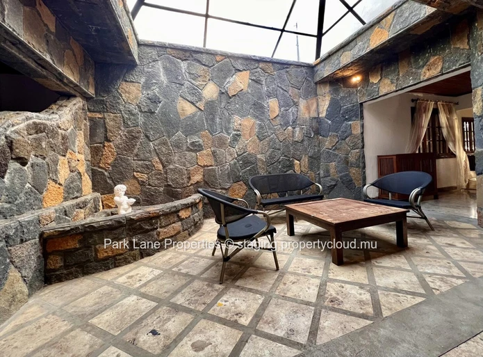 Double-storey home overlooking a magnificent pool and mature trees in Floreal