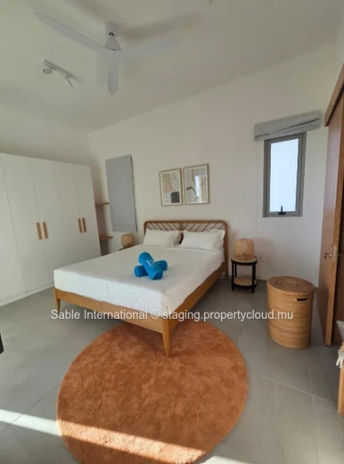 Luxury Penthouse with Pool Access in Péreybère! 2 Beds, Rooftop, Sea Access, Parking, AC. Close to Shops & Hospital.