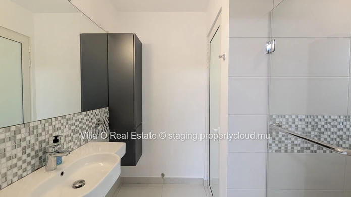 Nestled in the heart of Floreal, this architectural gem offers a modern lifestyle with an omnipresent nature that ill... (Sole Mandate)