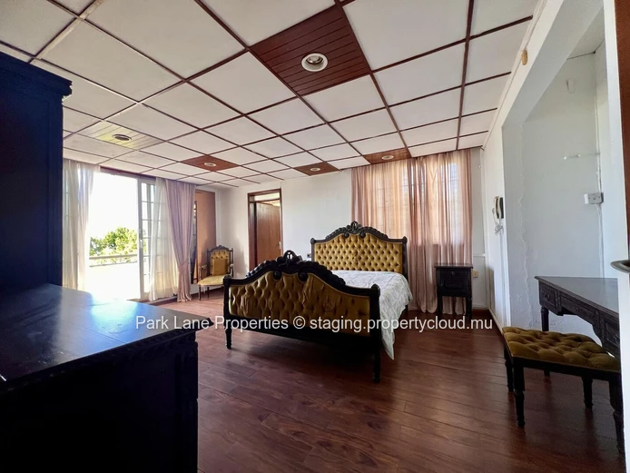 Double-storey home overlooking a magnificent pool and mature trees in Floreal
