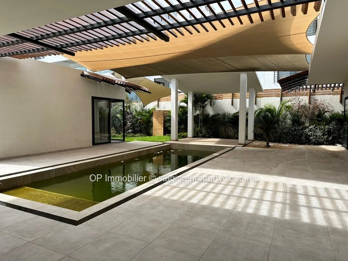 "Exquisite 4-bedroom home with private pool in Grand Baie, fully furnished, close to amenities. Price: €25M"