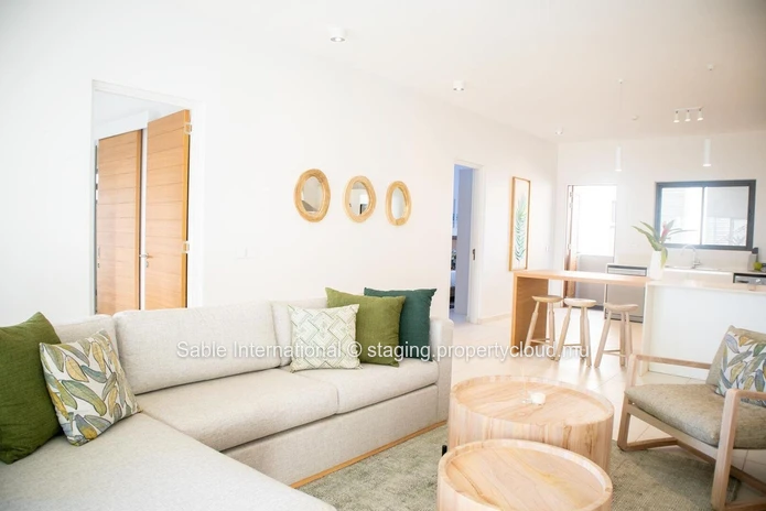 Appartement R+2 à vendre à Péreybère, 101m², 2 chambres, piscine commune, proche de la mer et des commerces.