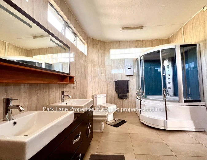 Double-storey home overlooking a magnificent pool and mature trees in Floreal