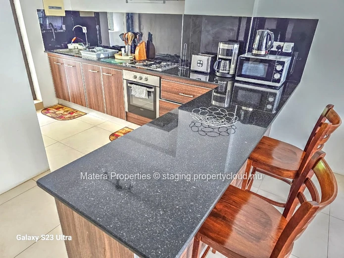 Stunning 110m² Apartment in Flic en Flac with Common Pool & Secure Parking - Fully Furnished & Close to the beach.